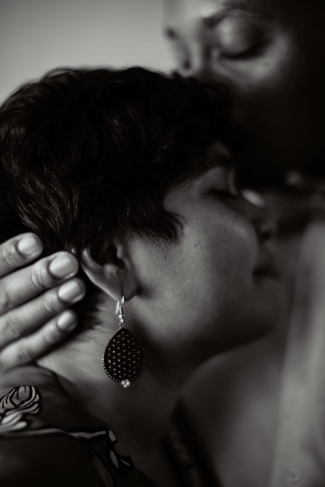 Close-up of couple embracing cheek to cheek