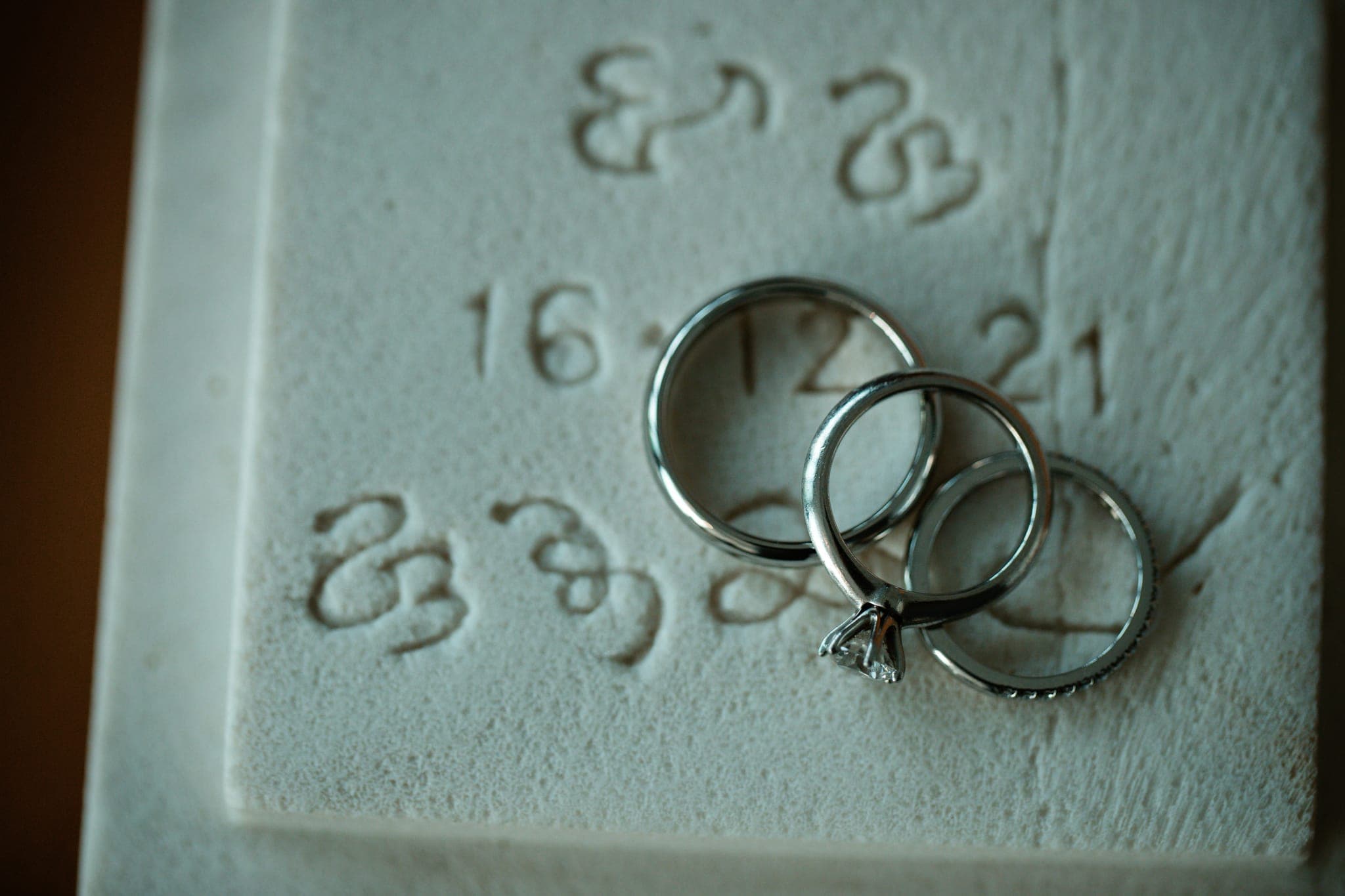 Wedding rings on stamped paper with numbers